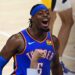 Luguentz Dort celebra título de la NBA con una bandera haitiana y otra de Canadá